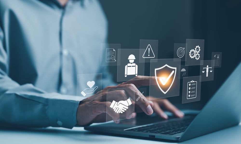 Professional insurance advisor discussing coverage options with a young couple in an office setting